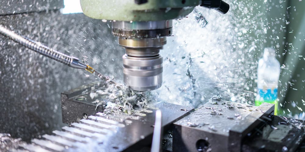 A CNC milling machine performing a grinding operation.